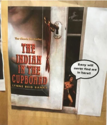 A poster from the film "The Indian in the Cupboard" showing an Indigenous man peeking out of a white cupboard; a white text bubble is superimposed on the poster with the text "Beny will never find me in here!!"